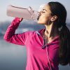 64oz glass sports water bottle with motivational time marker, straw, silicone sleeve, handle, and hydration tracker
