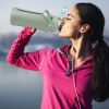 64oz glass sports water bottle with motivational time marker, straw, silicone sleeve, handle, and hydration tracker